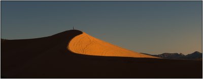 A Sunset Stroll Across A Sand Dune