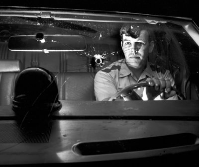 Depurty Sheriff Jeff Jackson With Bullet Hole in Windshield