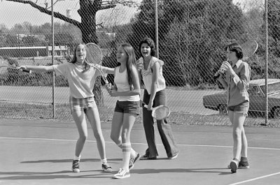 Playing Tennis At City Park