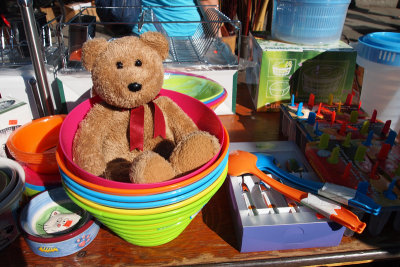 Playing at the sidewalk market....