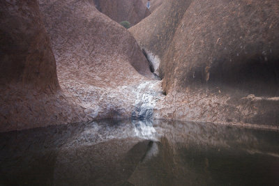 Rainwater dring into a pool from the rock