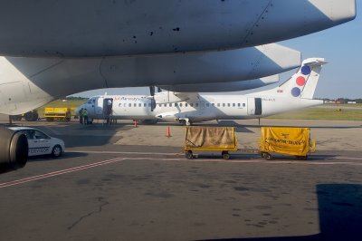 Boarding Lufthansa RJ85 Regional Jet, gate A3 at Belgrade airport. View to ATR72 of JAT