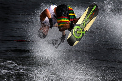 PUTRAJAYA, MALAYSIA - NOV 09: Aliaksei Zharnasek performs in the tricks event on the wakeboard at the Waterskiing and Wakeboard 