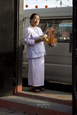 Nun asking for alms at temple door