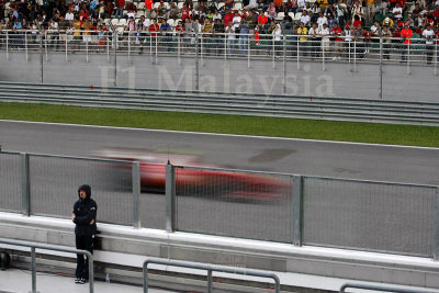 Ferrari blazing past the grandstand