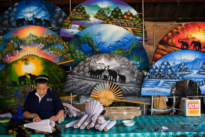 An artist prepares the umbrella in the umbrella factory..