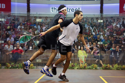 Mens final: Tarek Momen upset Mohamed El Shorbagy in a tensely fought match.