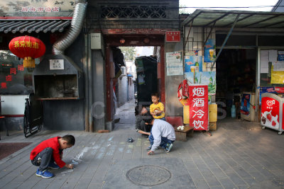 Kids playing outside their hutong homes, Beijing