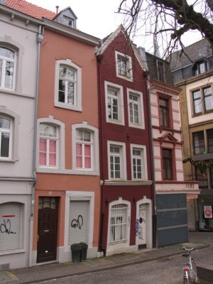 Colorful and leaning buildings by the square Katschof
