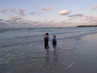The young photographer and his assistant on the beach