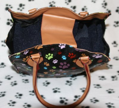 Tan trim and handles feel like soft leather