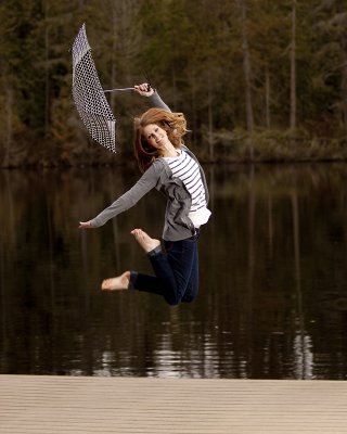 Emily jumping with the umbrella