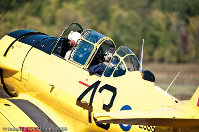 Aviation photo-journalist Eric Dumigan is in the rear seat of a Harvard preparing to photograph Edwards' flight.