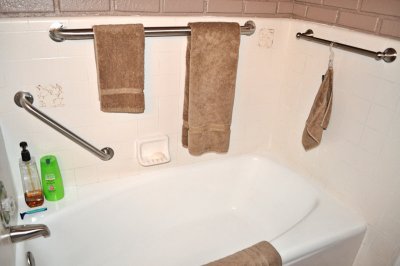 Refinished Tub with New Towel and Grab Bars