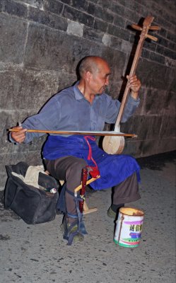 Musician at Market street at night