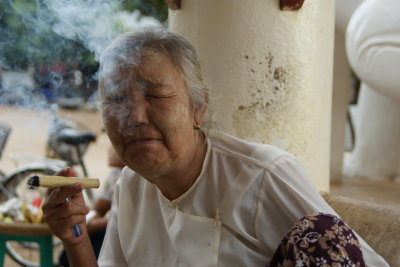 Old Lady Smoking Cigar