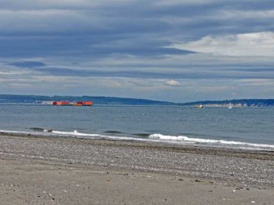 Alaskan barge towed by Tugboat