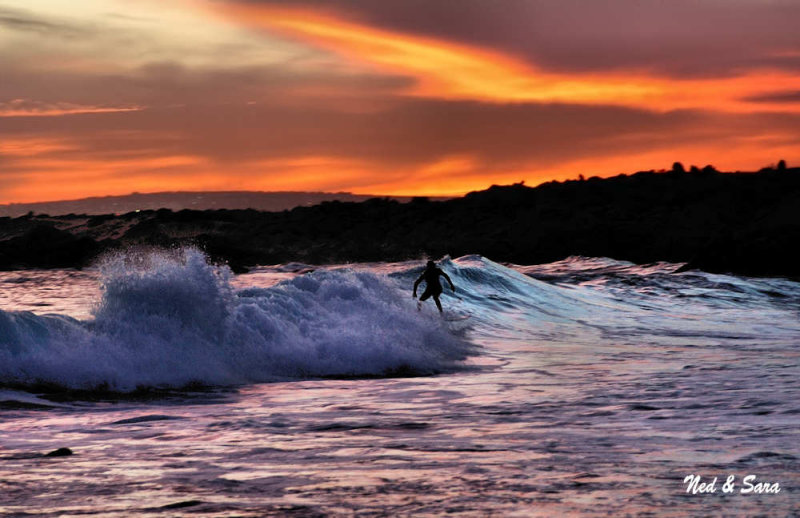 surfing at  sunset
