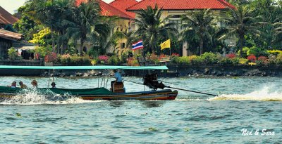 longtail boat speeding down the Chao Phraya River