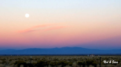 moon over the desert before sunrise