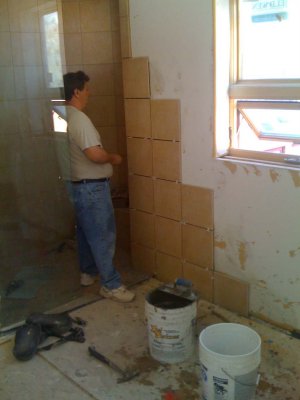 Carlos adds some new tiles to the wall