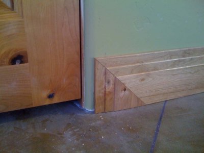 Corner treatment for cherry baseboards