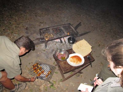 Cooking over coals for bush camp