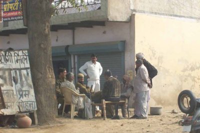 Men playing cards (including a military man)