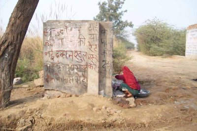 Washing clothes by the side of the road