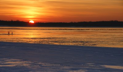 Sunrise over frozen lake.