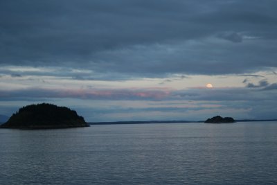 Full moon rising at sunset.