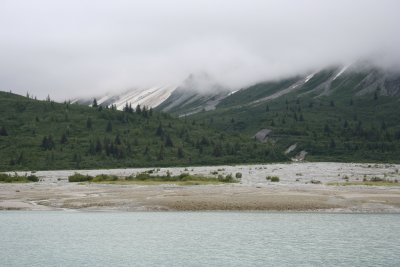 Occasionally (but not often) the glaciers would leave large deposits of soil as they receded, and flat shoreline would develop.