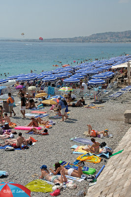 Nice's Rocky And Crowded Beach--Two Images