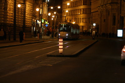 crossing the street from National Theatre towards Cafe Kavarna Slavia