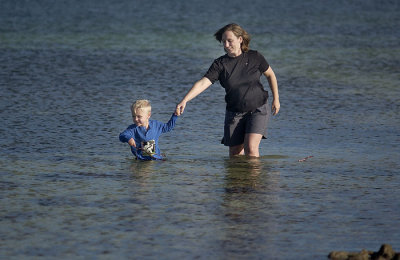 Simon pulls Mommy toward deeper water