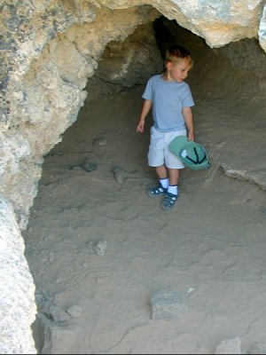 He looks for bears in a cave