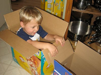 Simon loves the new supply of diaper boxes