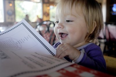 Kristina reads her menu