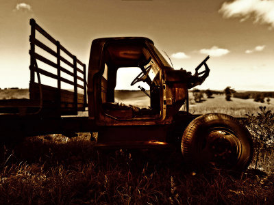 Old truck in field by Dennis
