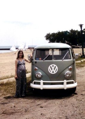 Pregnant hippie girl with VW camper.