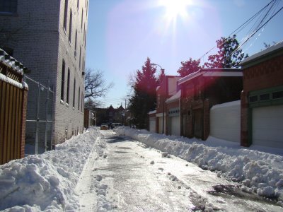 alley between 11th and 12th Streets SE, plowed thanks to a neighbor with a pickup truck and plowblade (seen down the end) Sunday