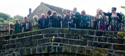 John's friends pay their respects with flowers