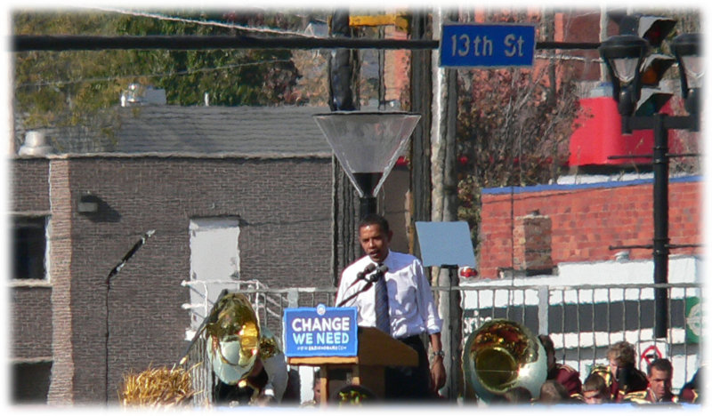 Between a light pole and 2 tubas