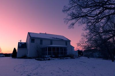 Mid-winter sunset over a snow-covered landscape