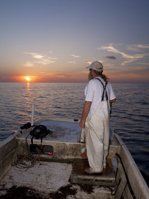 Commercial Fisherman Al Fariss Watches The Sun Set