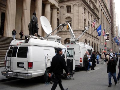Reporters' vans at Wall Street