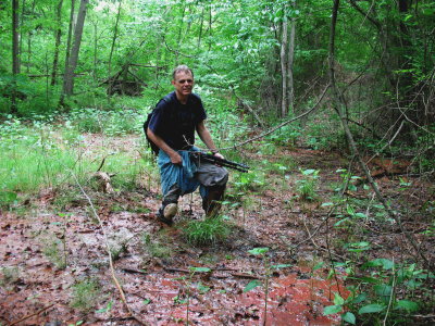Tom nearly succumbs to over-the-boot mud while on the trail of C. kentuckiense. (photo by Eric Lamont)