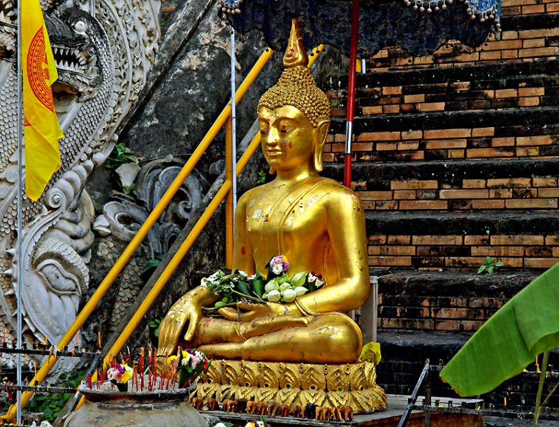 Buddha image with lotus buds