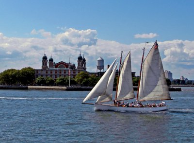 Sailboat with Ellis Island in the background