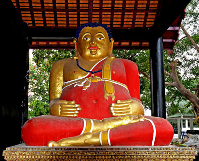 Image of Happy Buddha in red robe